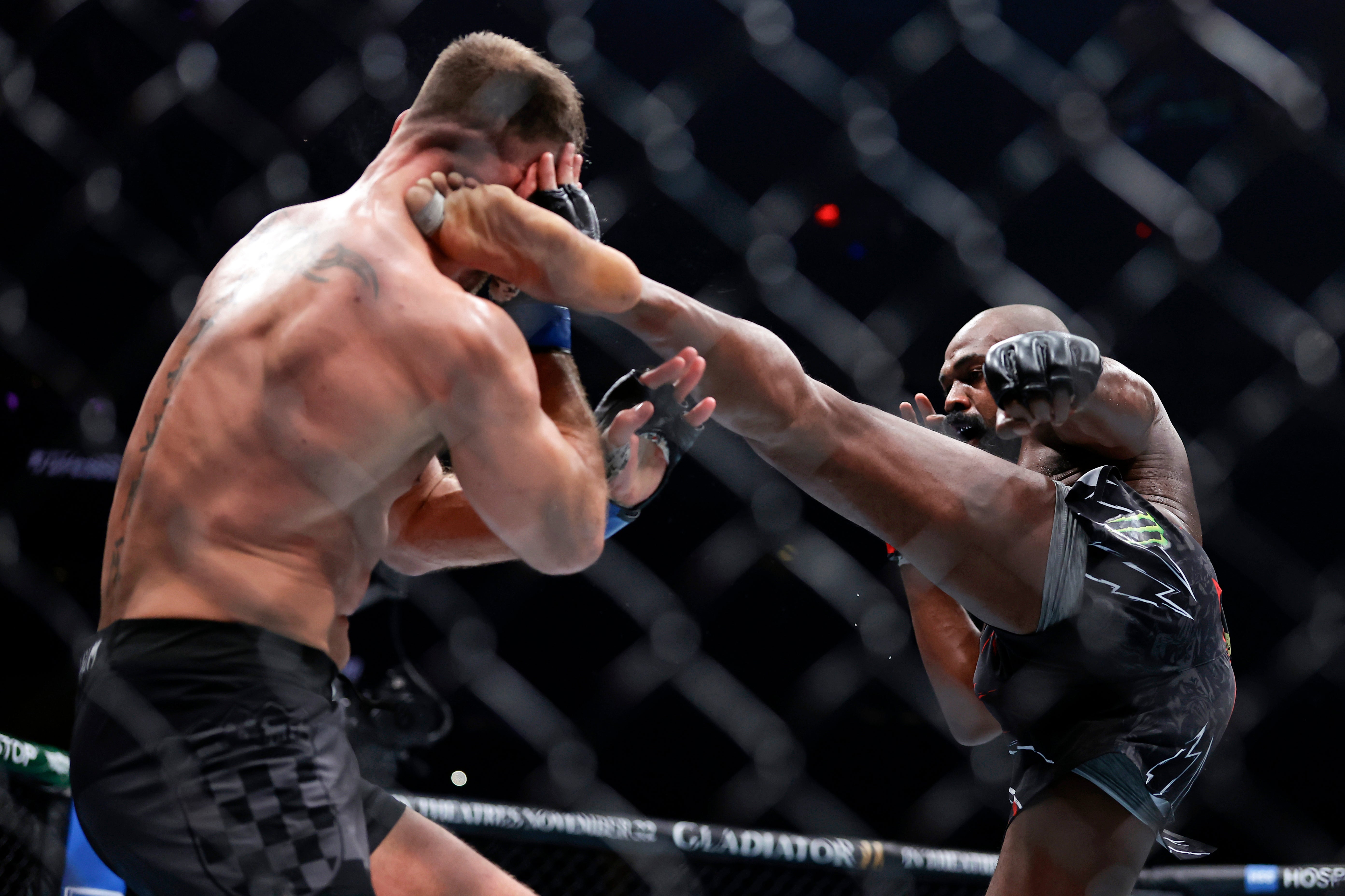 Jon Jones (right) during his win over heavyweight great Stipe Miocic in November