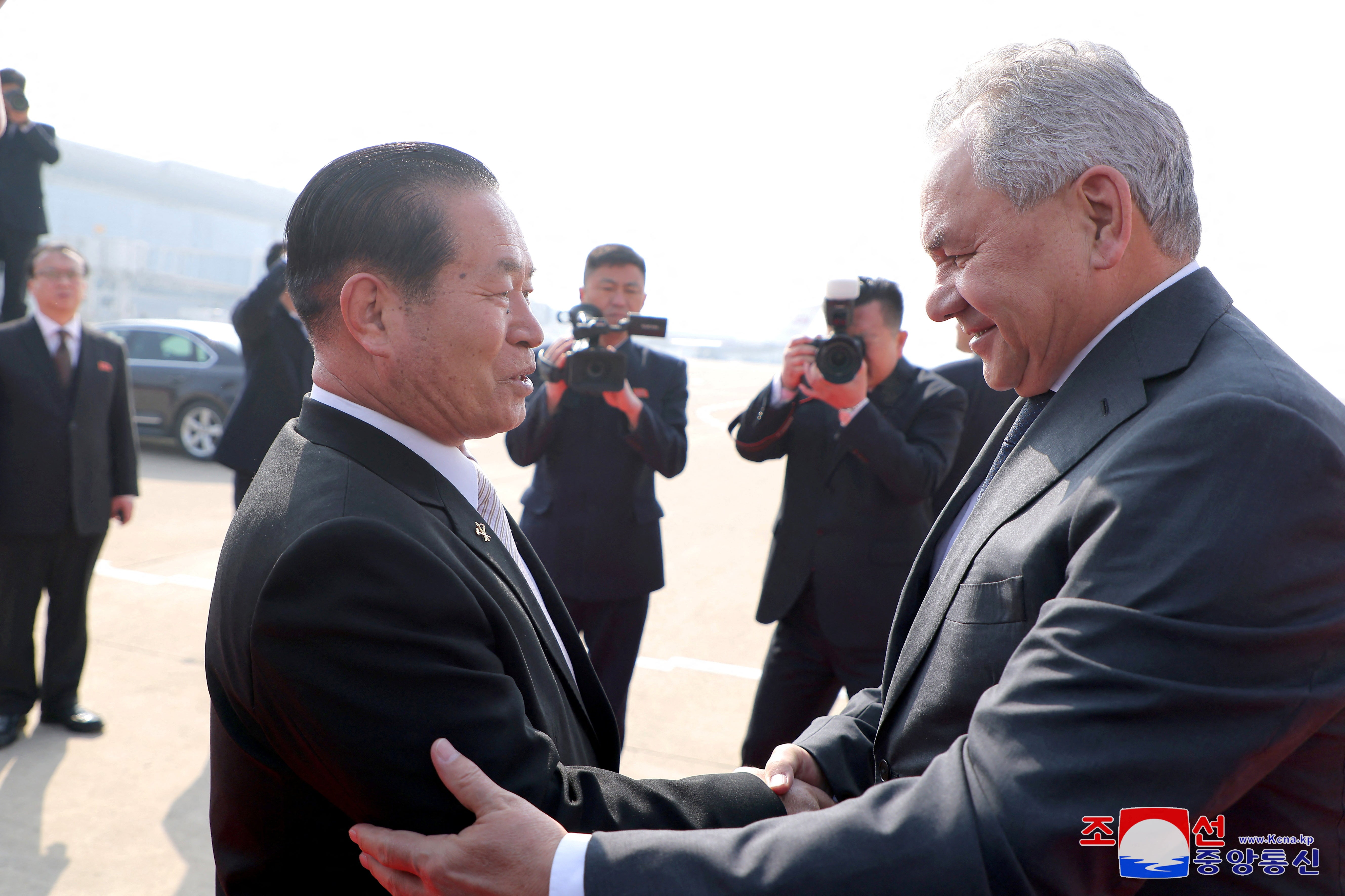 Russian President Vladimir Putin's top security adviser Sergei Shoigu meets a North Korean official during his visit to North Korea