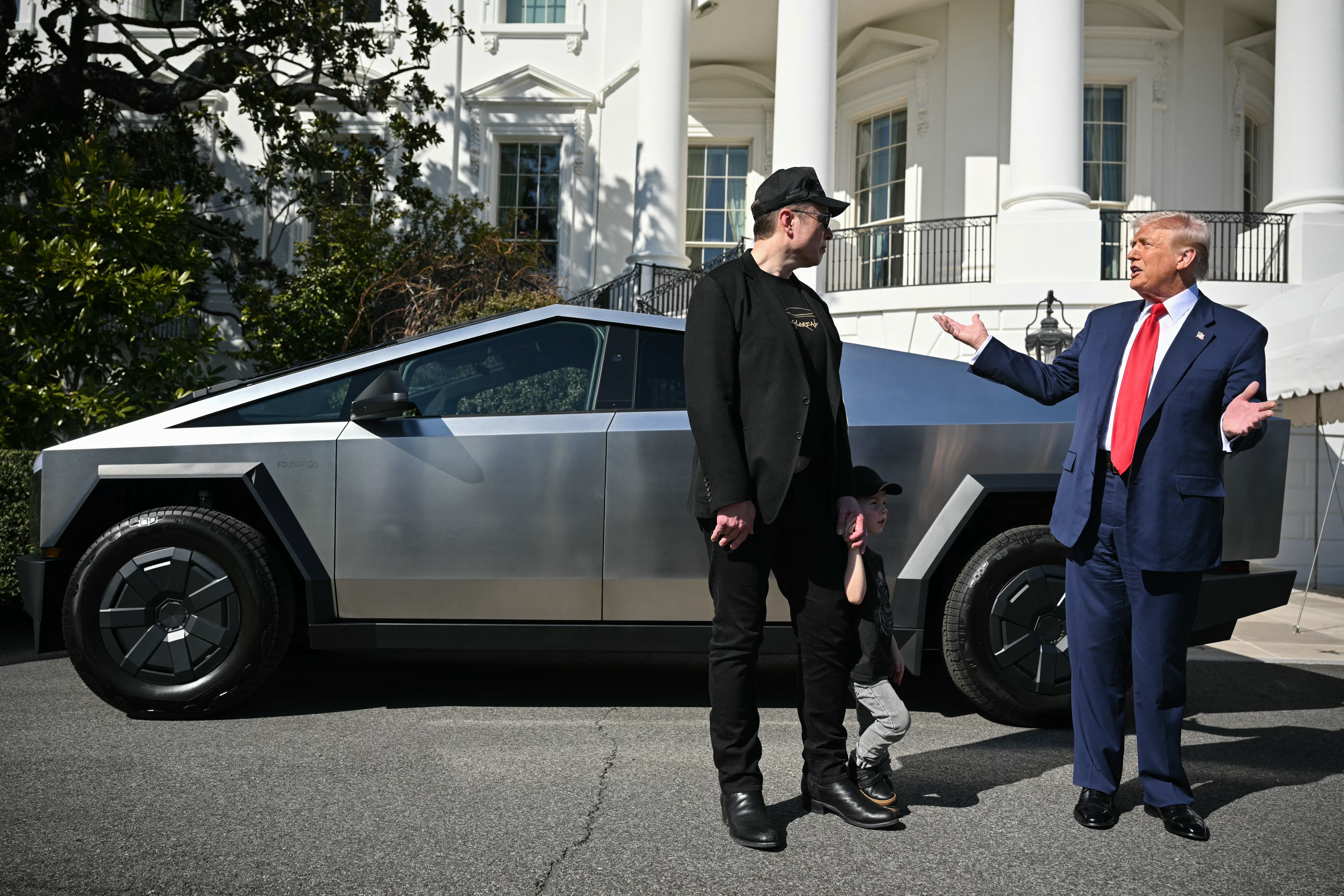 Trump and Musk pose with a Tesla Cybertruck outside the White House on March 11