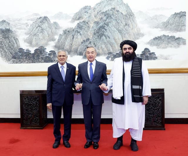 <p>Pakistan foreign minister Ishaq Dar, Chinese foreign minister Wang Yi and Taliban foreign affairs minister Amir Muttaqi during their informal meeting in Beijing, China</p>